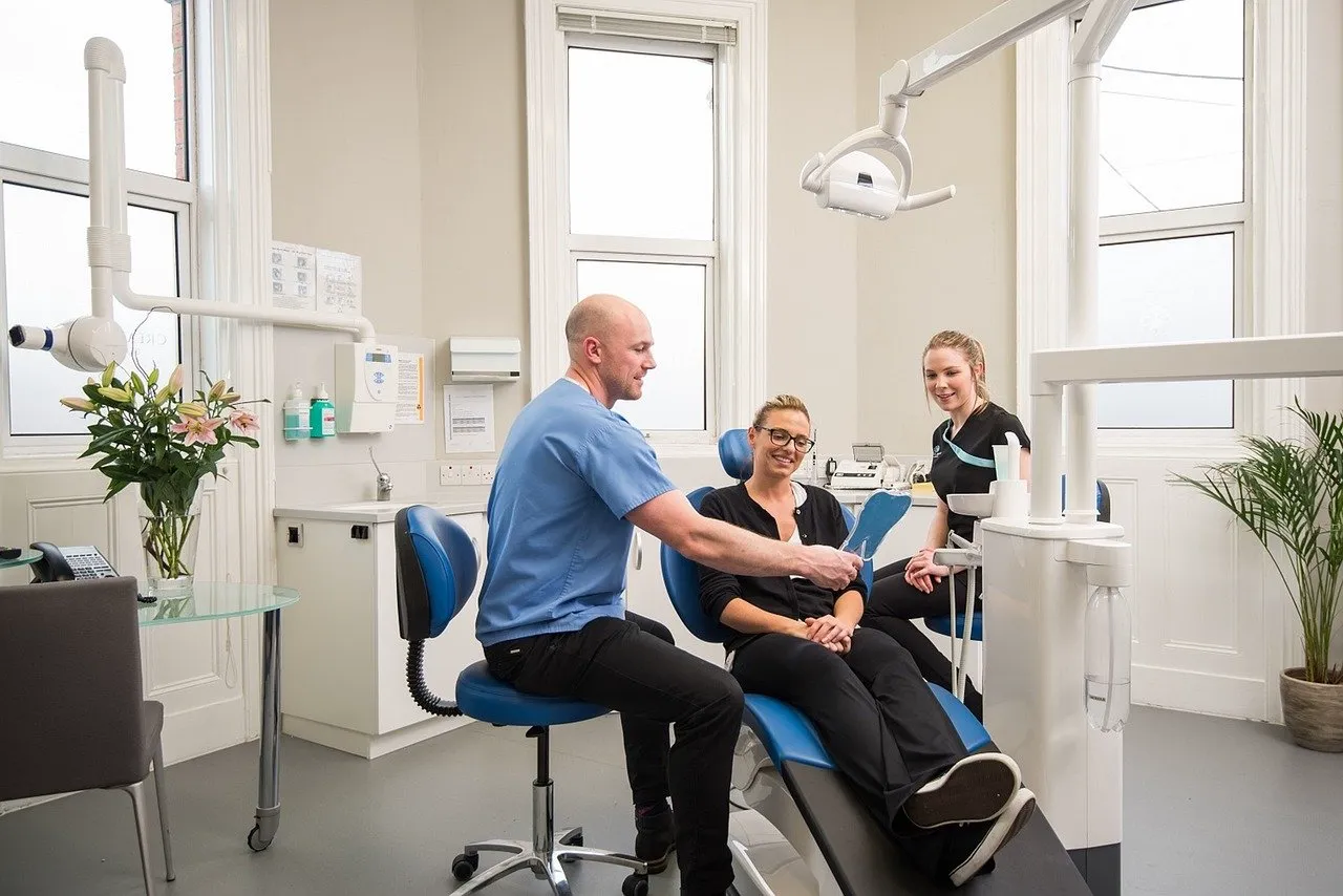 Dentist consulting with a patient in a bright clinic